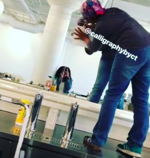 I had to stand on the bar in order to write so high on the mirror!