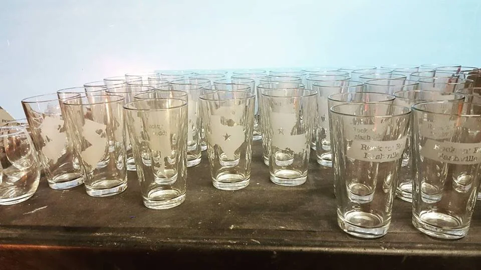 Custom, hand etched glasses being prepared for shipment.