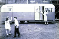 Old Trailer With Kids and Parent