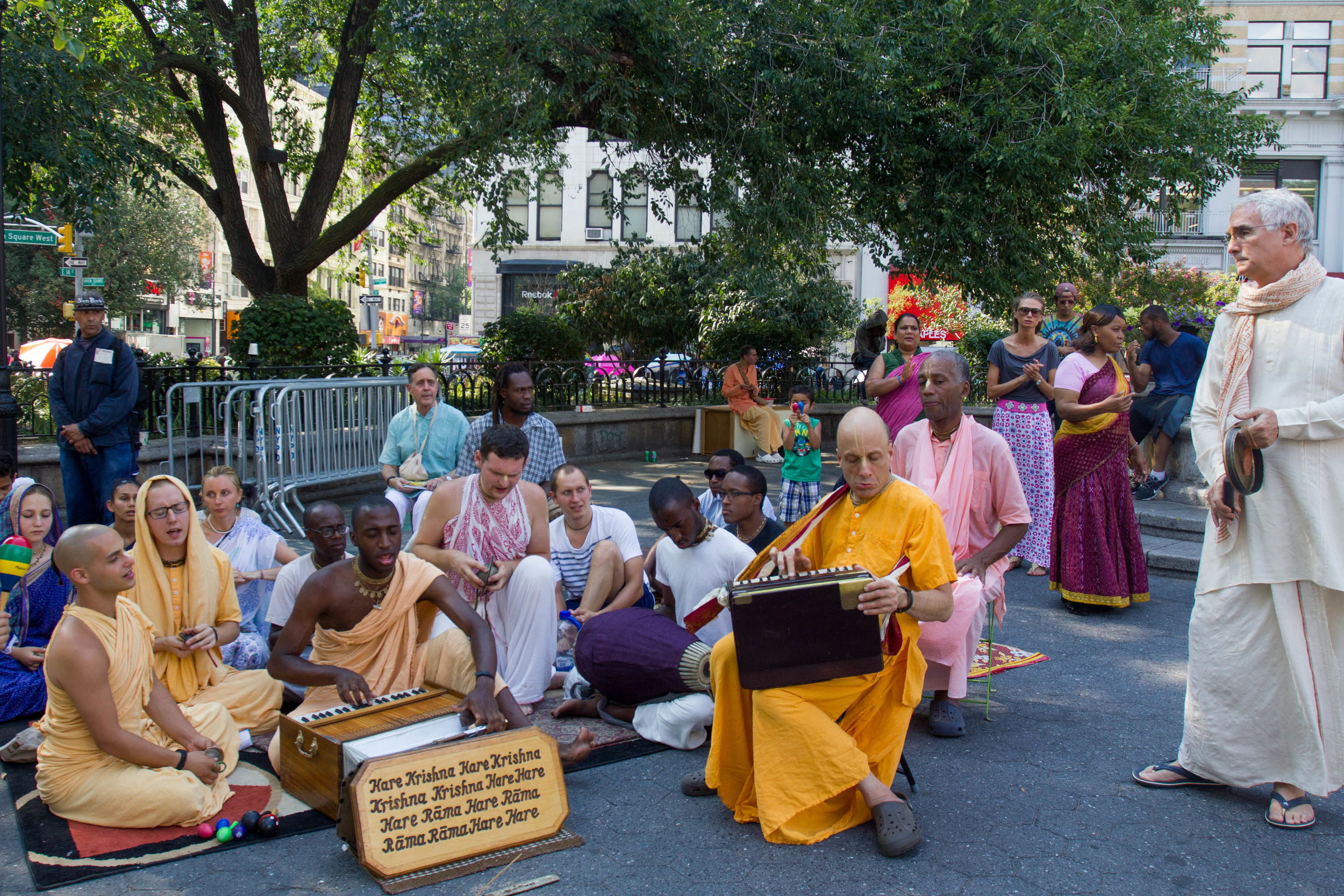 Hare Krishna devotees sit together and chant in Union Square