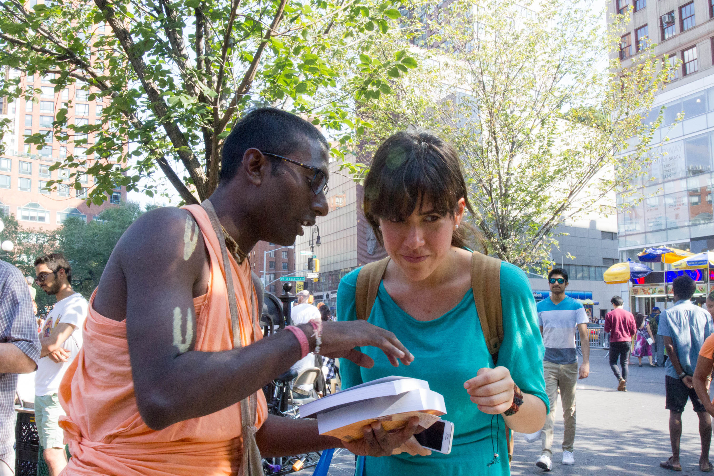 Nihal explains the core principles of the Hare Krishna movement to an interested passer-by