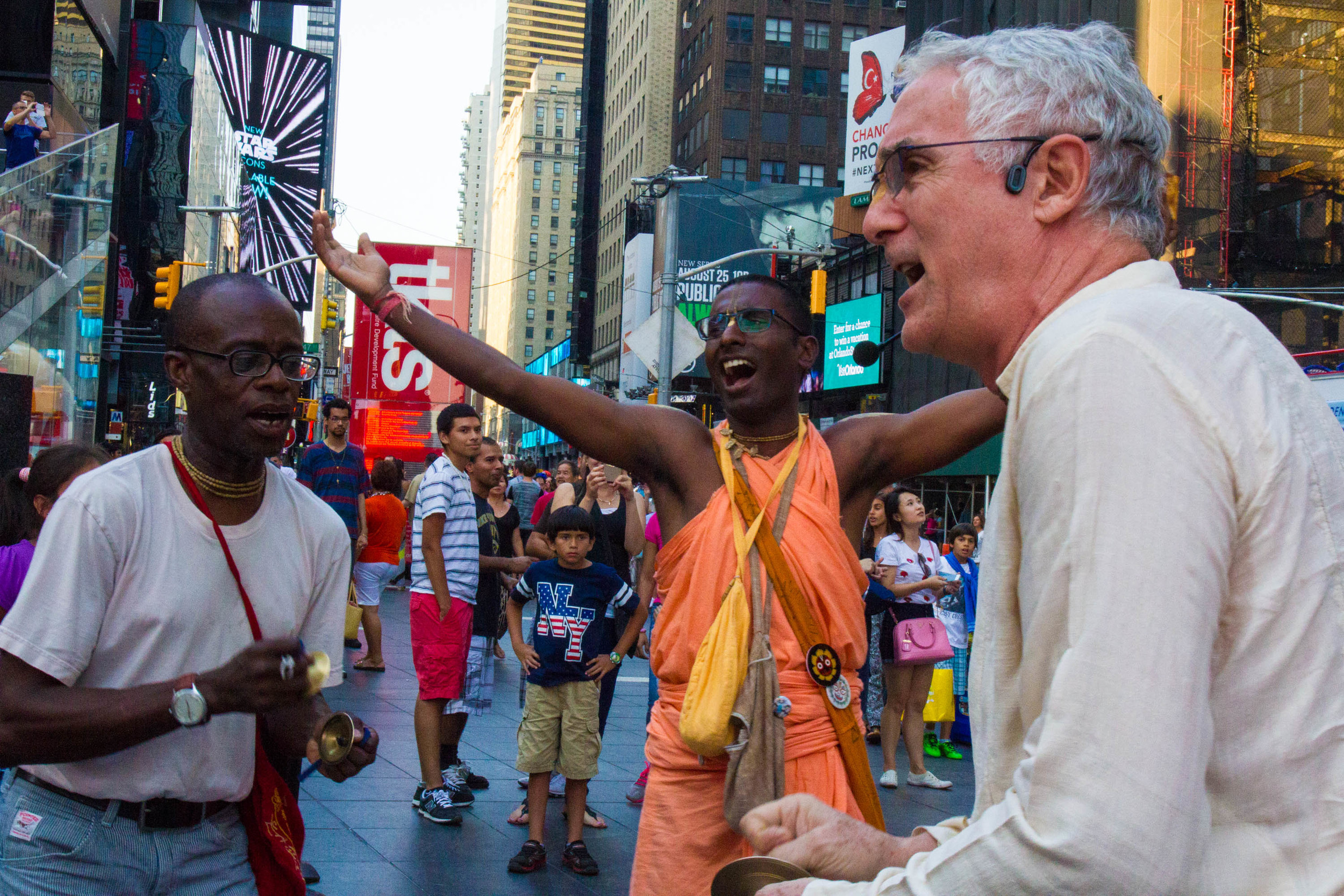 Nihal (centre) dancing and chanting with fellow devotees in Times Square