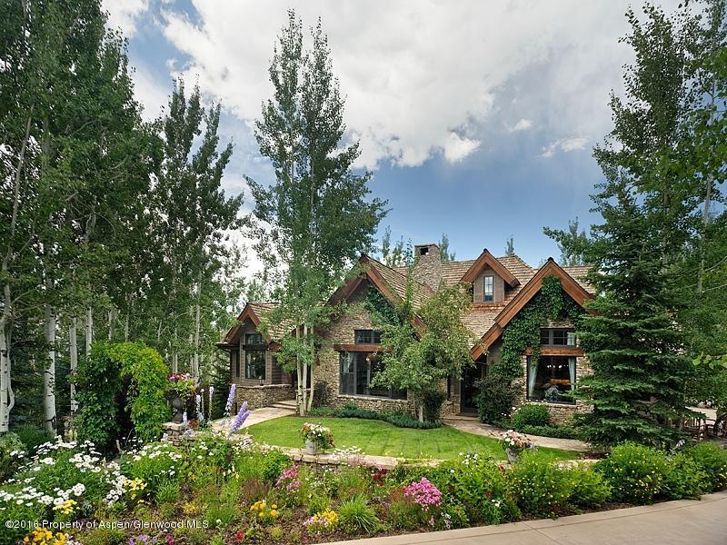 The quiet entry features beautiful landscaping, handcrafted stone, flower garden and the highest quality materials throughout the home.