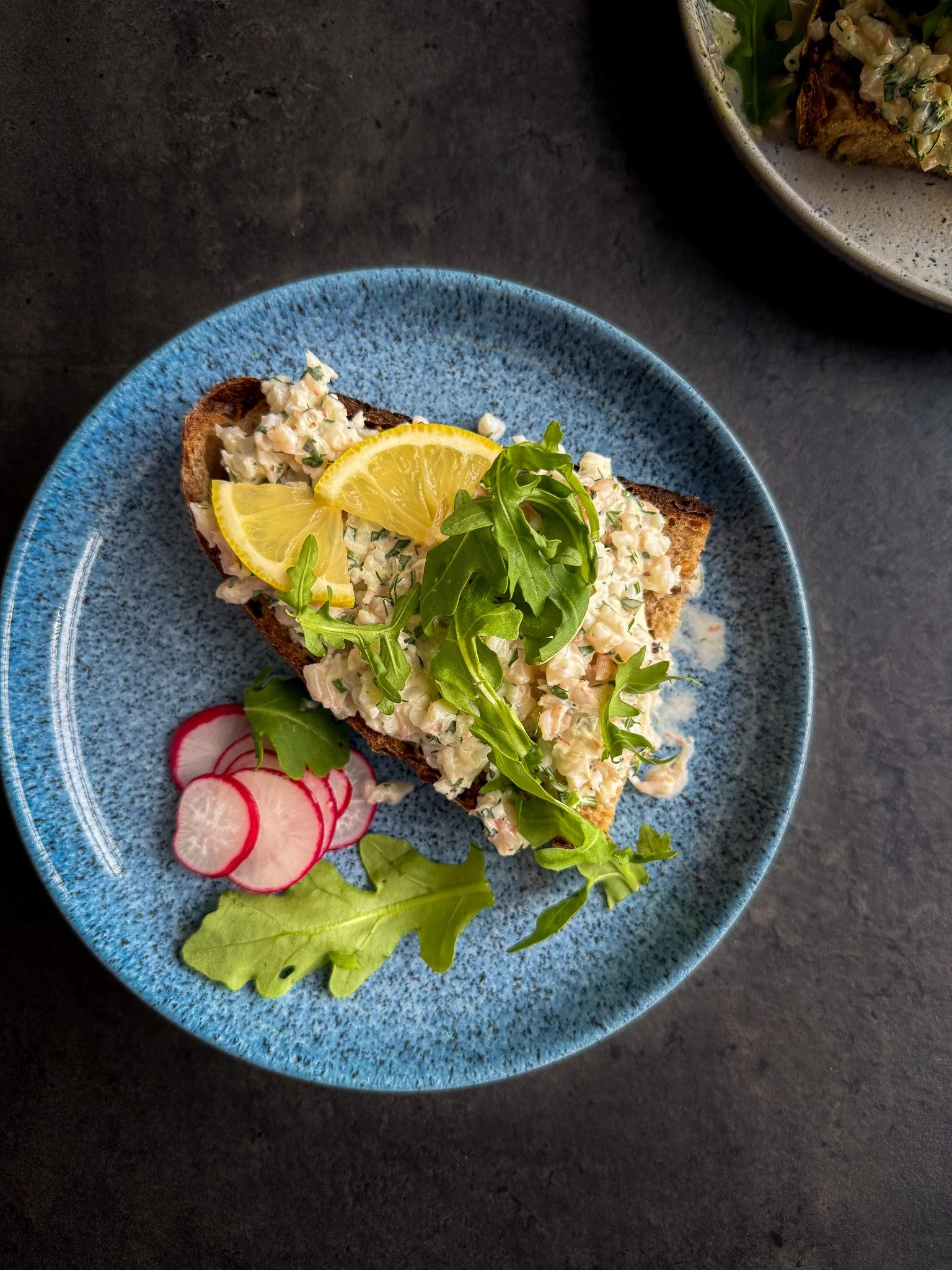 Scandi prawn sandwich on a blue plate