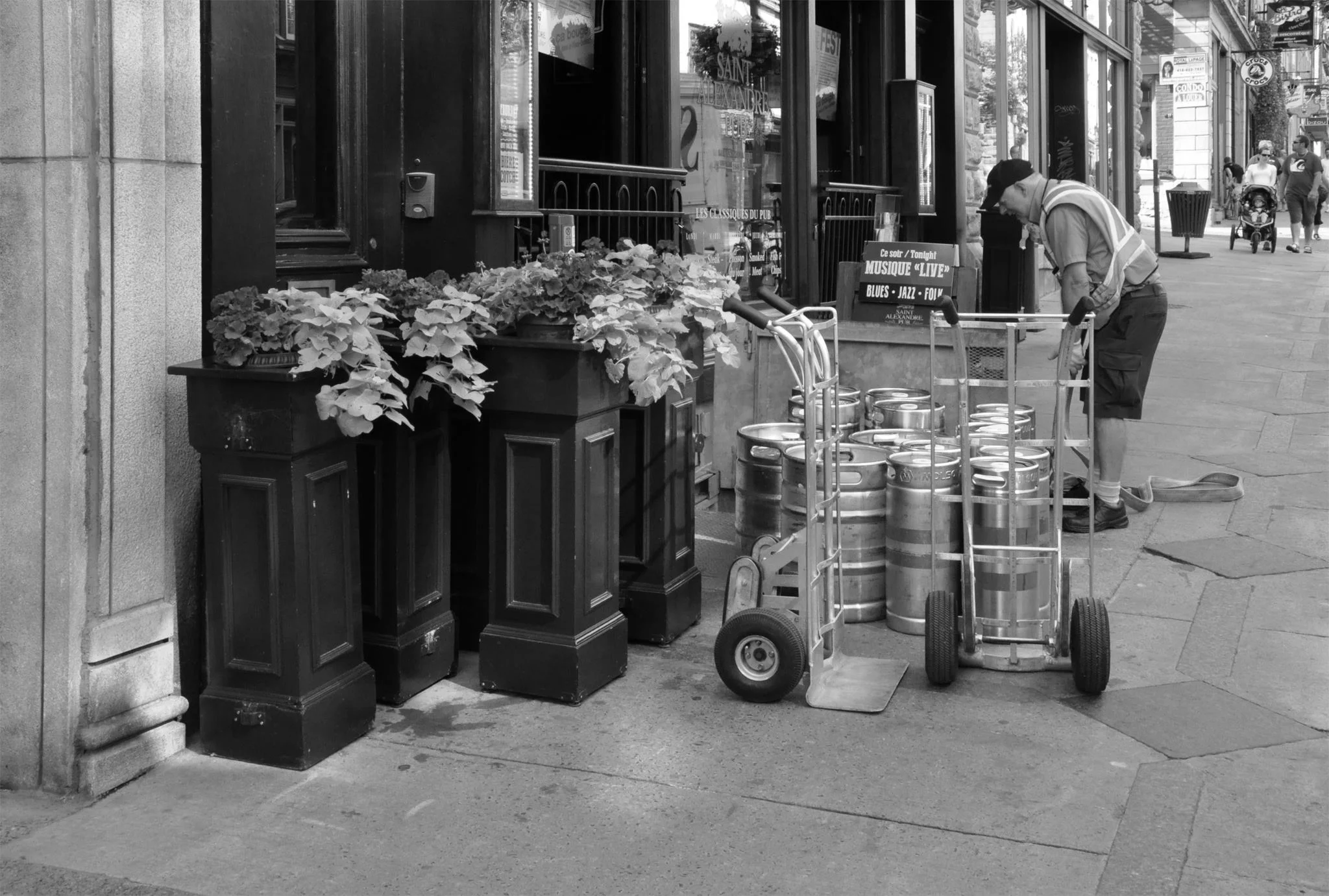 In the morning, the cafe's planters and barricades are tucked up against the building.