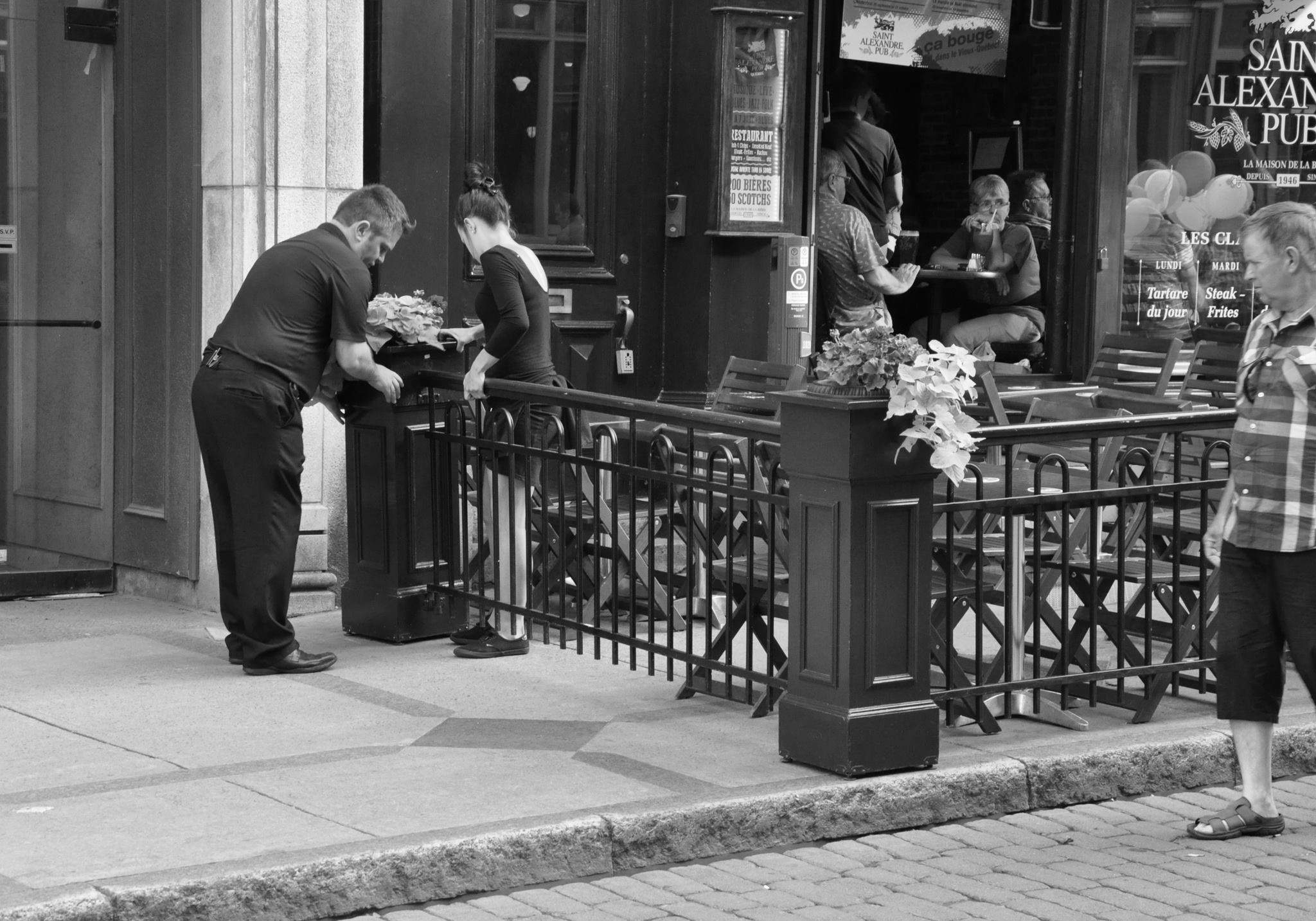 In the late afternoon, restaurateurs rearrange the space, changing the sidewalk to dining area and the carriageway to shared space.
