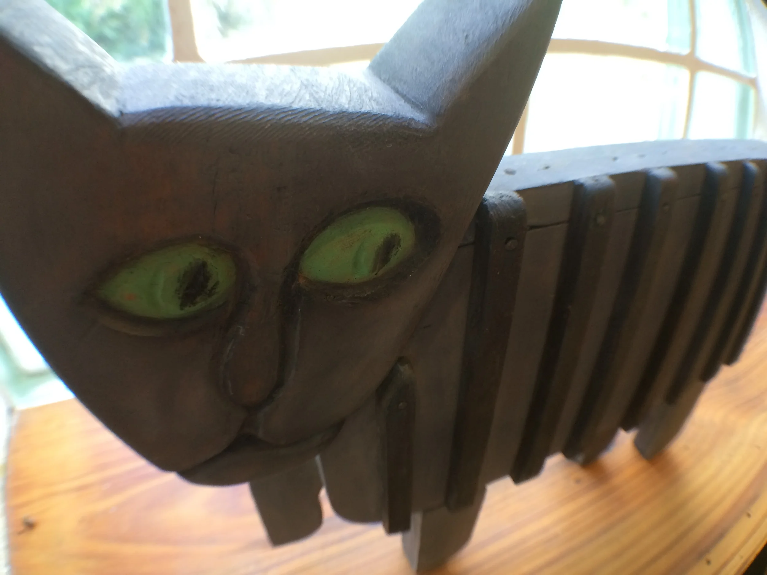  A lovely wooden cat sculpture by my friend Michael Baggett. He's so cool you can't even FIND his stuff online. 