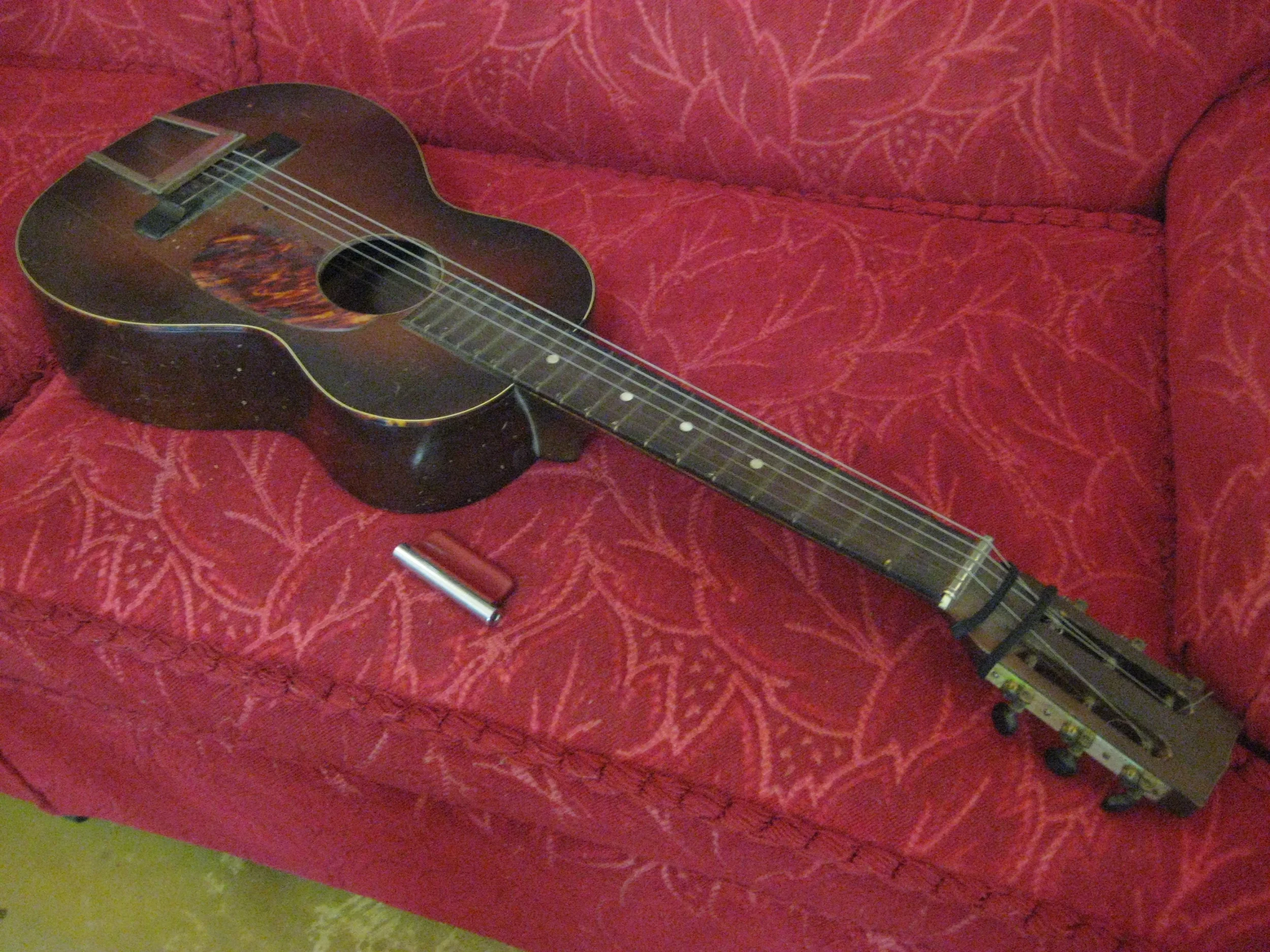  This guitar was owned by someone named H. O. Bouchard here in Austin in the 30's. He wrote his address on the inside of the case... (19th street, before it was MLK blvd.) It was in an antique store in Bertram, Texas. I picked it up to coax a little 