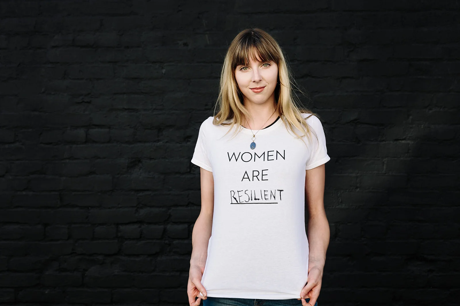 Brighid Quinn wearing her “Women are Resilient” t-shirt inspired by one of our Instagram followers! Thank you @raejus! Photo by Even Keel Imagery - Miriam Brummel .
