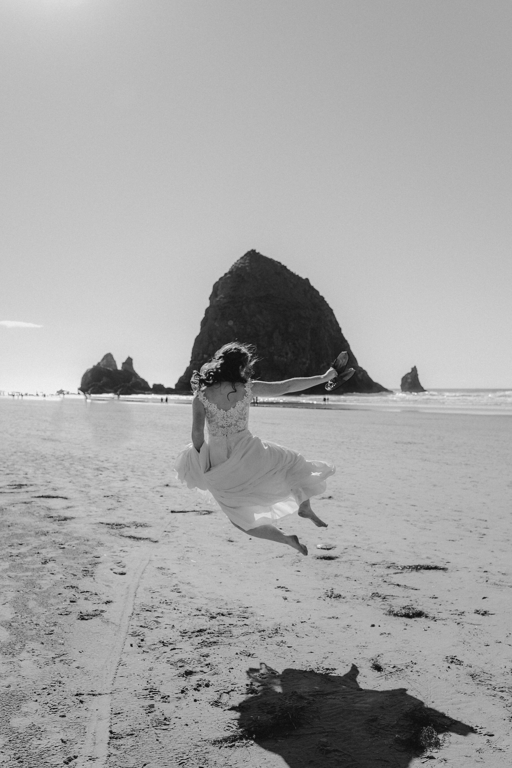 Cannon Beach wedding - Bride doing cute heel click