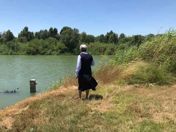 Sr. Norma surveys the Rio Grande with Mexico on the far side. 