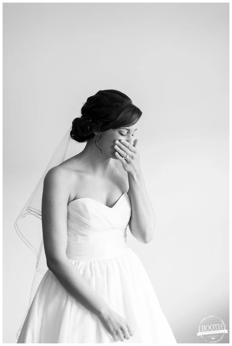 bride thinking about her groom and tearing up in her wedding dress