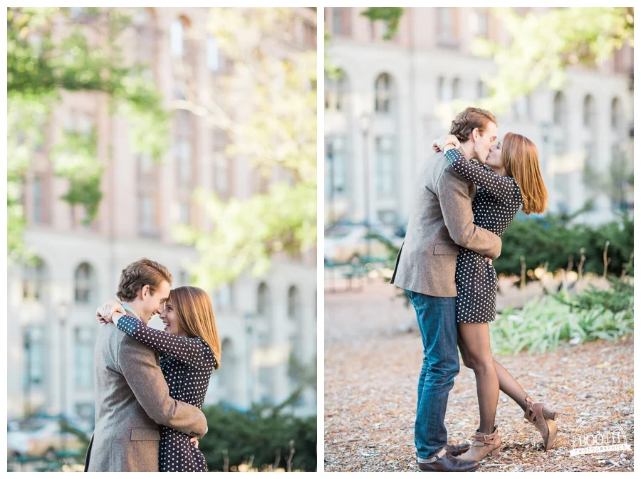 engaged couple dancing and kissing in front of City Hall in Milwaukee Wisconsin