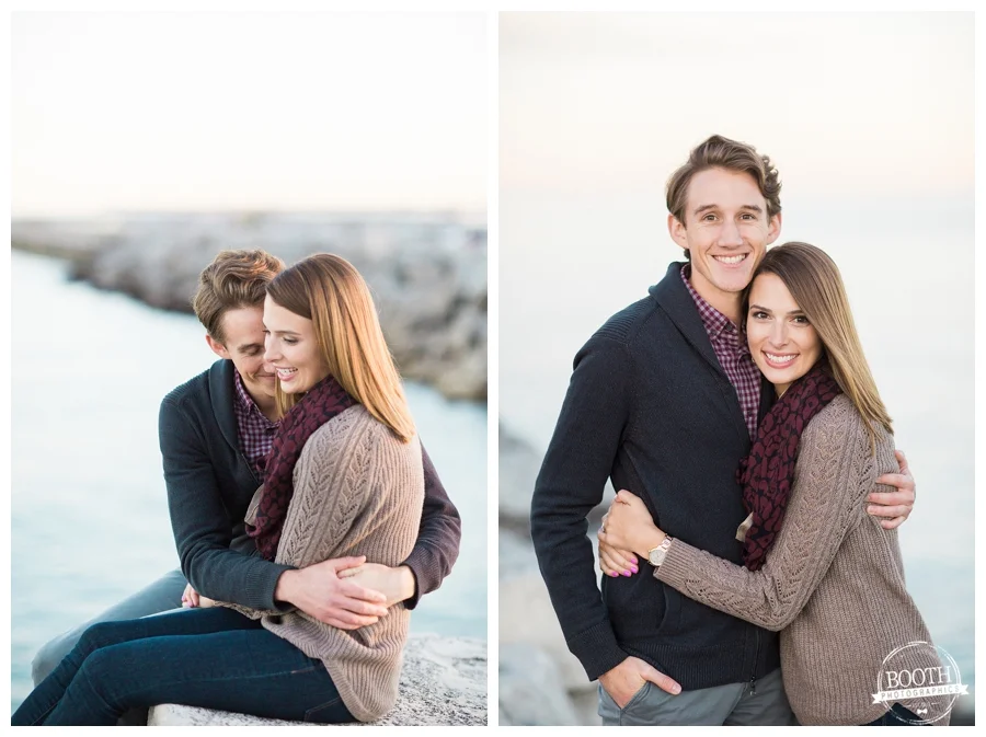engaged couple sitting along the rocks on Lake Michigan n Milwaukee Wisconsin