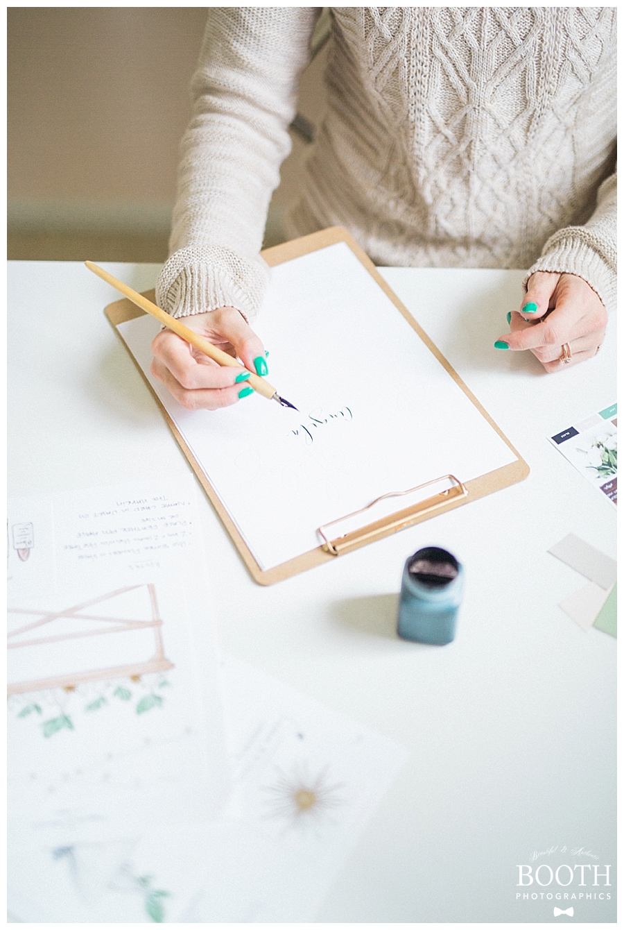 calligrapher creating a wedding logo in her mid century modern home office