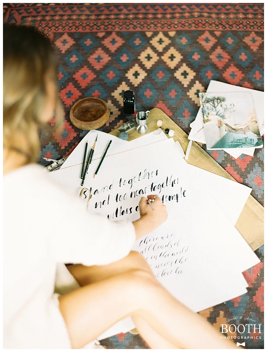 bride sitting on floor painting in her Colorado boudoir session by fine art film photographers, Booth Photographics