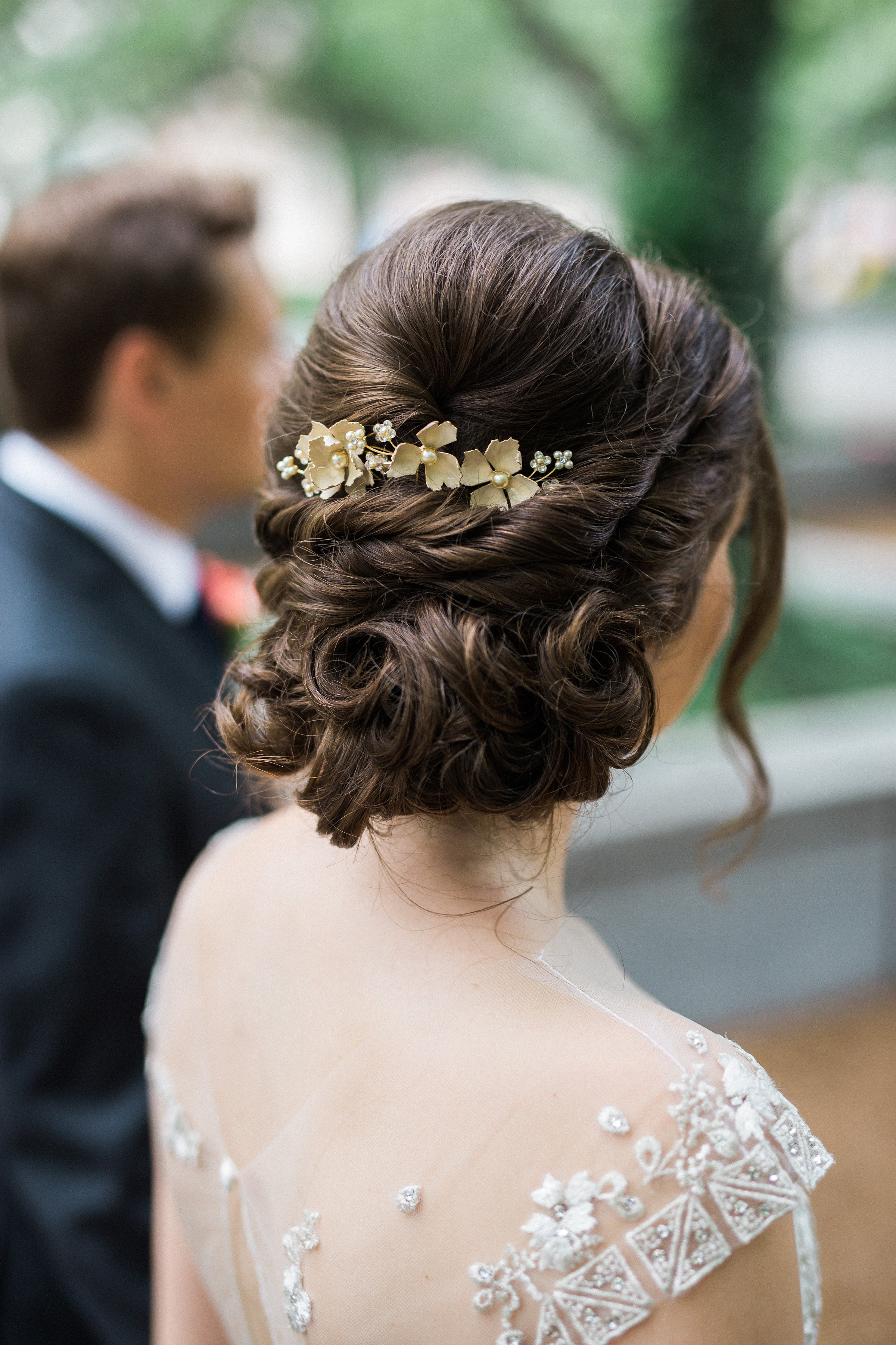 romantic and curly chignon for a garden wedding at Artifact Events