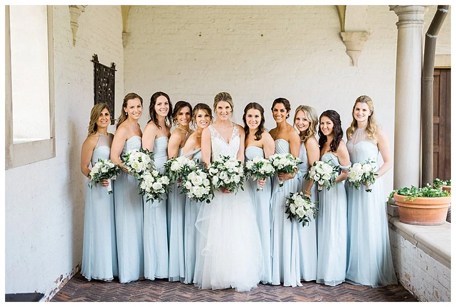 Bridesmaids in ice blue gowns for bridal party photos at the Villa Terrace Museum of Decorative Arts