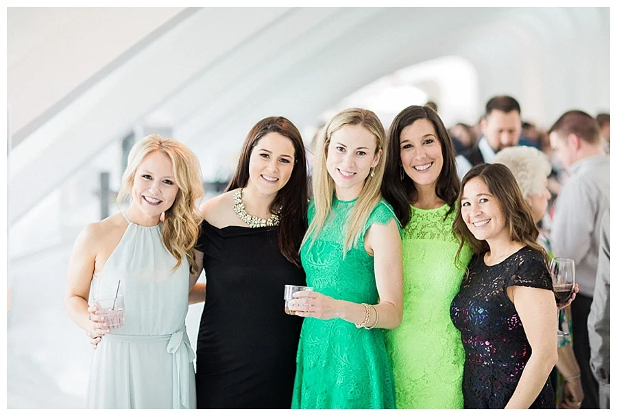 candid cocktail hour photos at Milwaukee Art Museum for their wedding