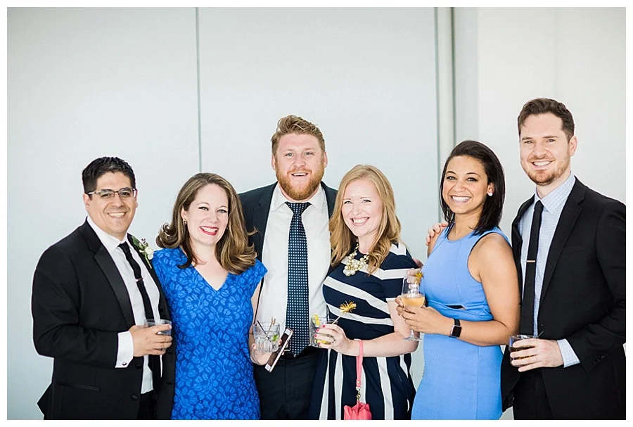 candid cocktail hour photos at Milwaukee Art Museum for their wedding
