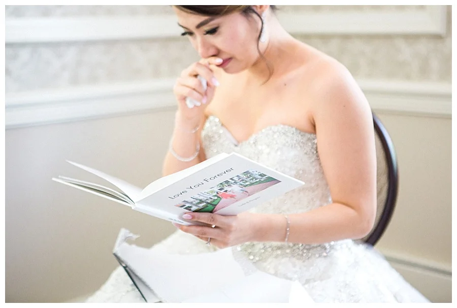 emotional bride reading a card from her groom