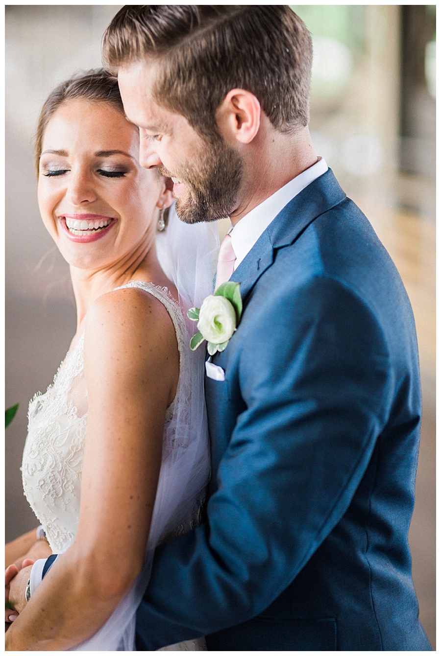 bride and groom photos on industrial bridge in Milwaukee