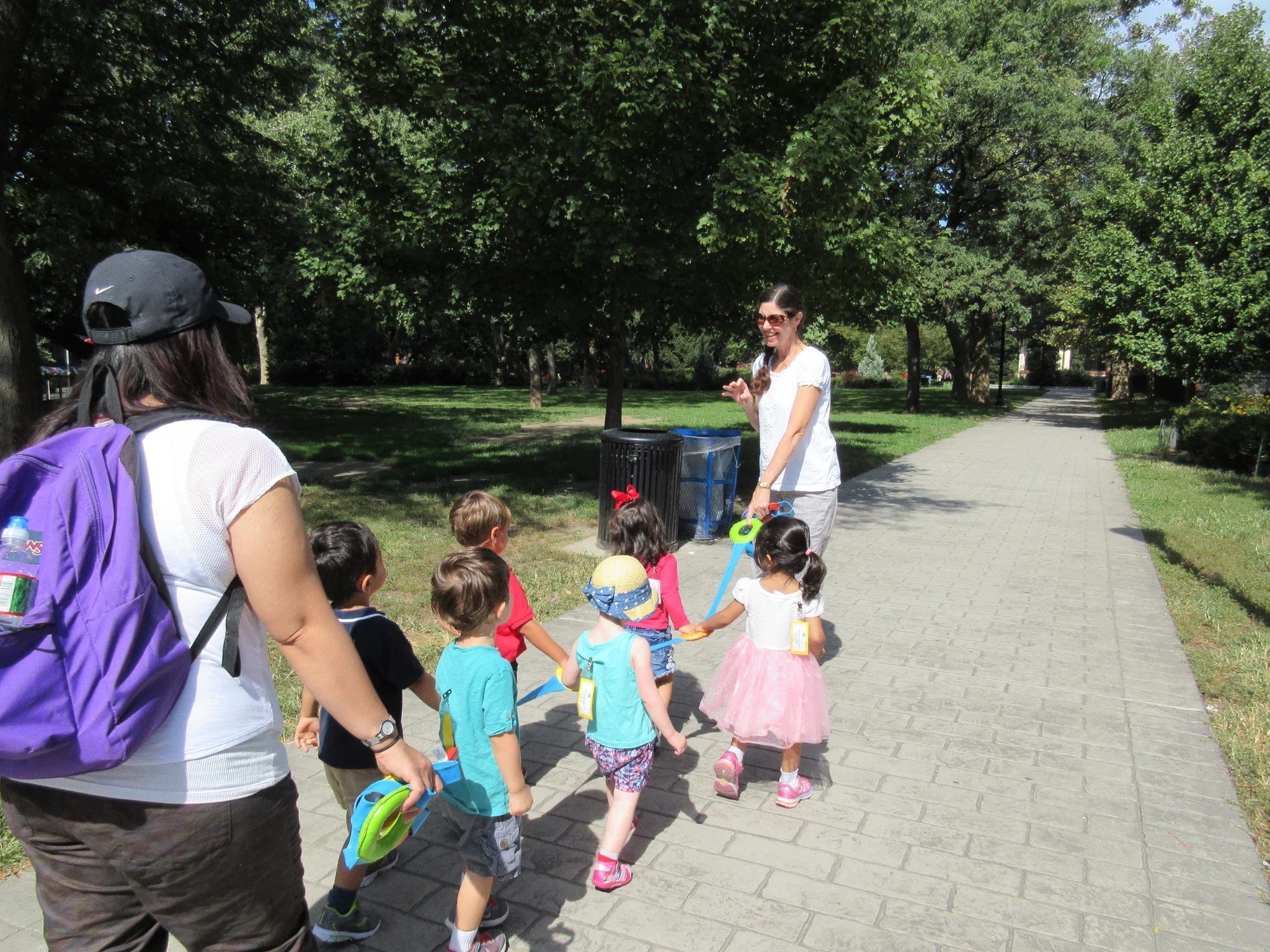 Learning to walk to the park holding the walking rope
