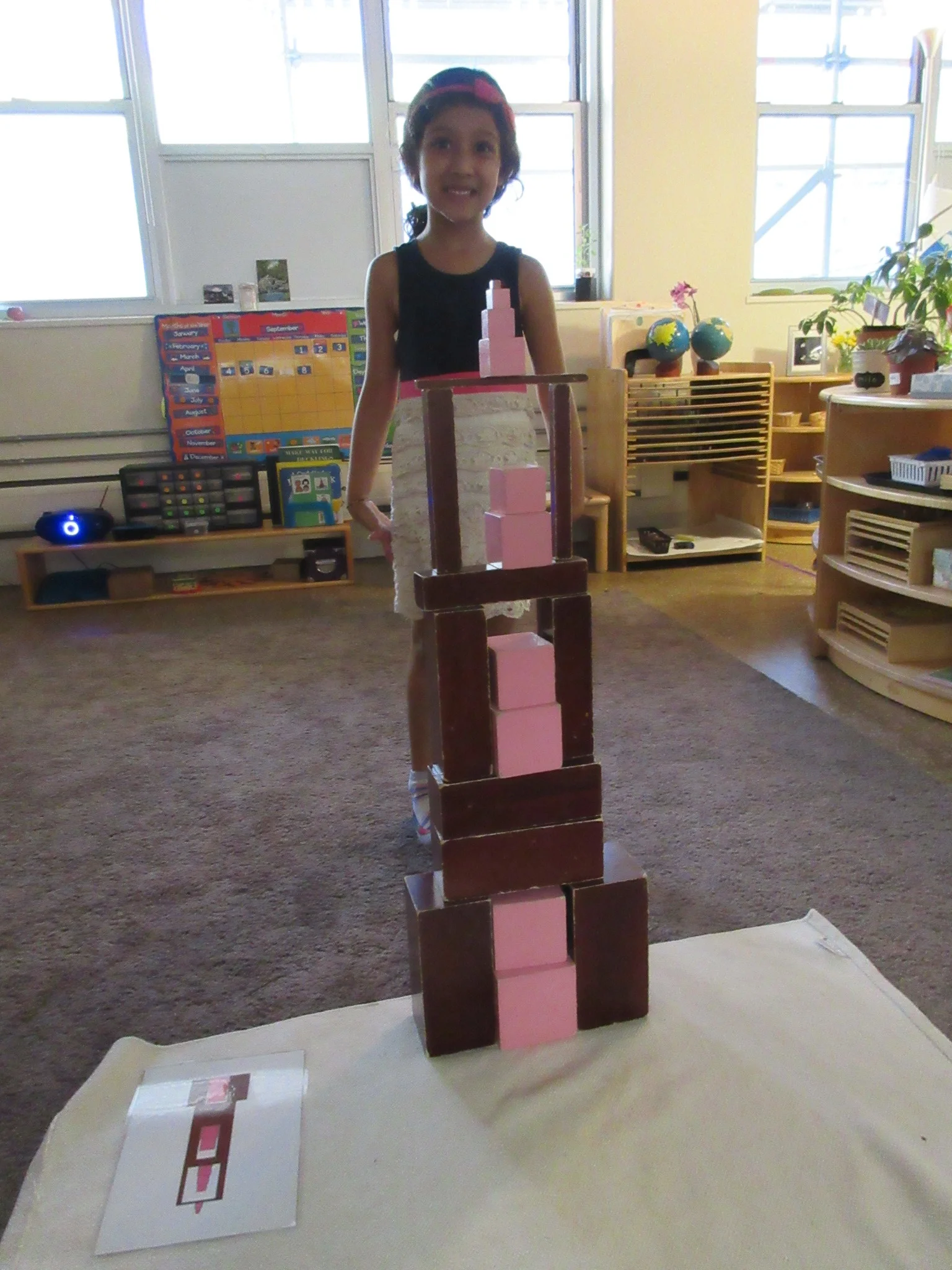 Creating a tower with the pink tower and brown stairs