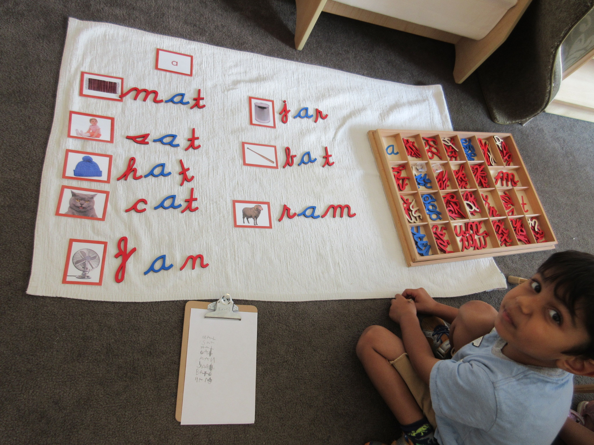 A child explores the Moveable Alphabet.