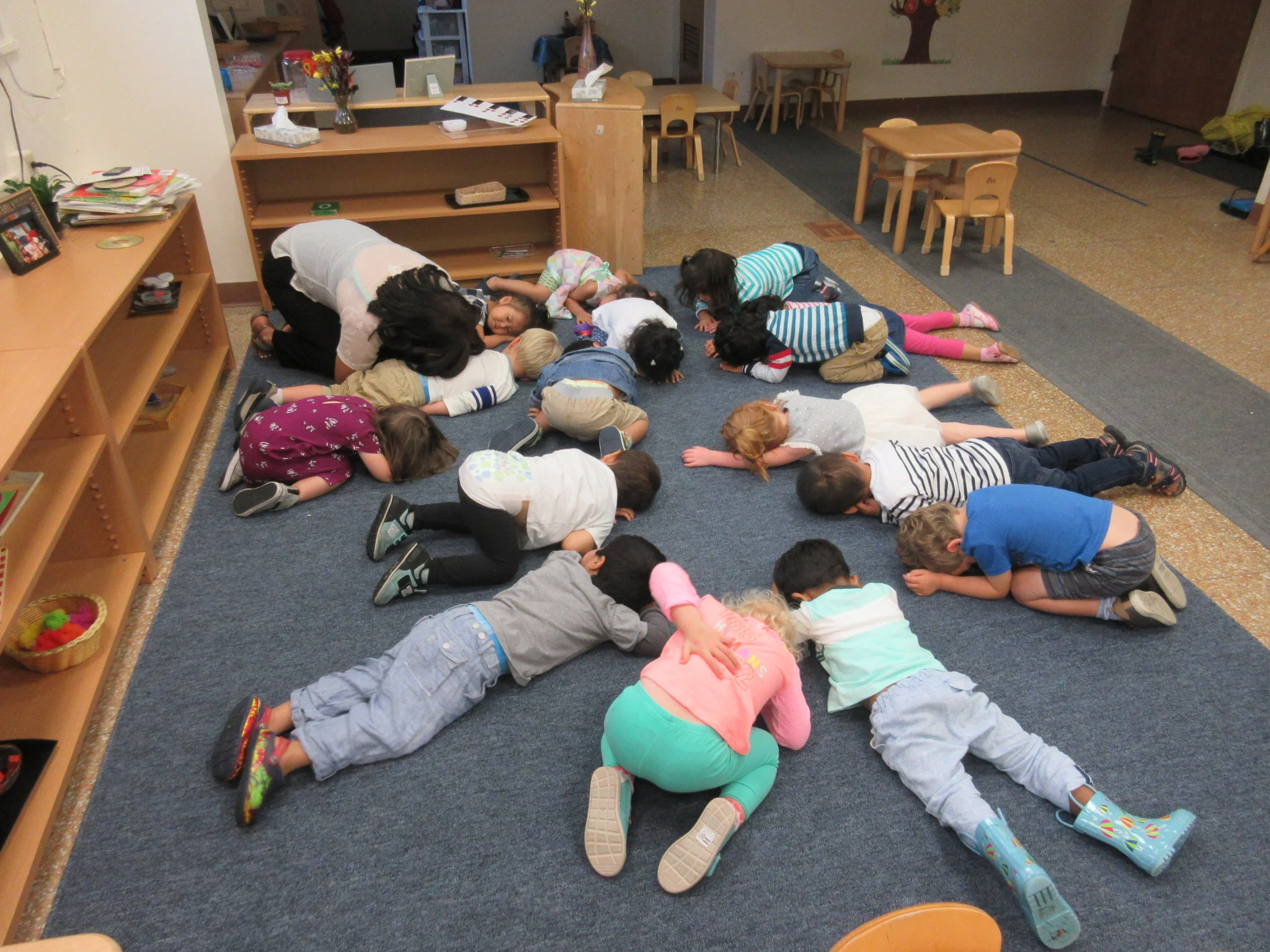 Doing some yoga (child pose) during circle time 