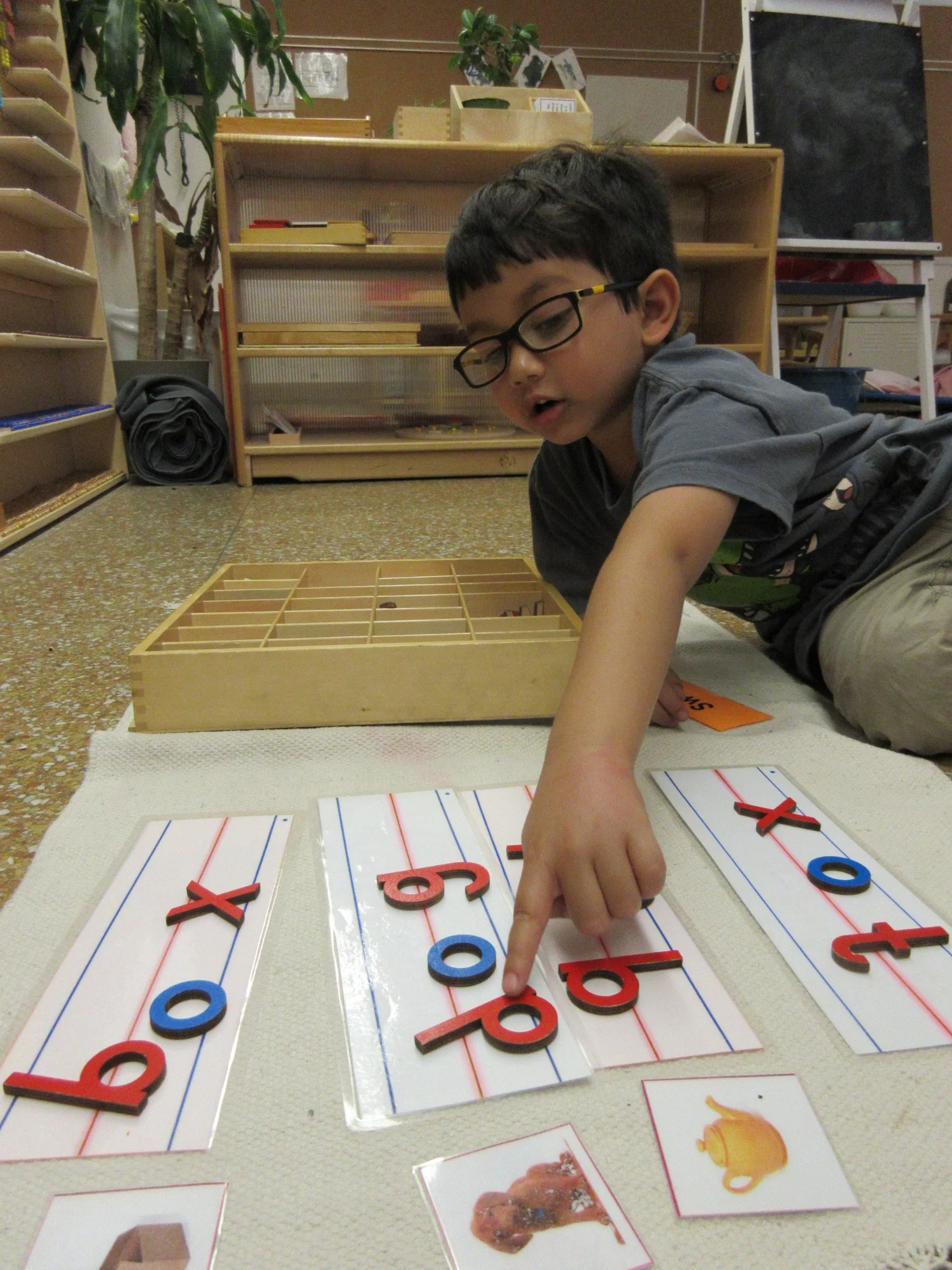 I'm sounding out and writing words with the Moveable Alphabet!