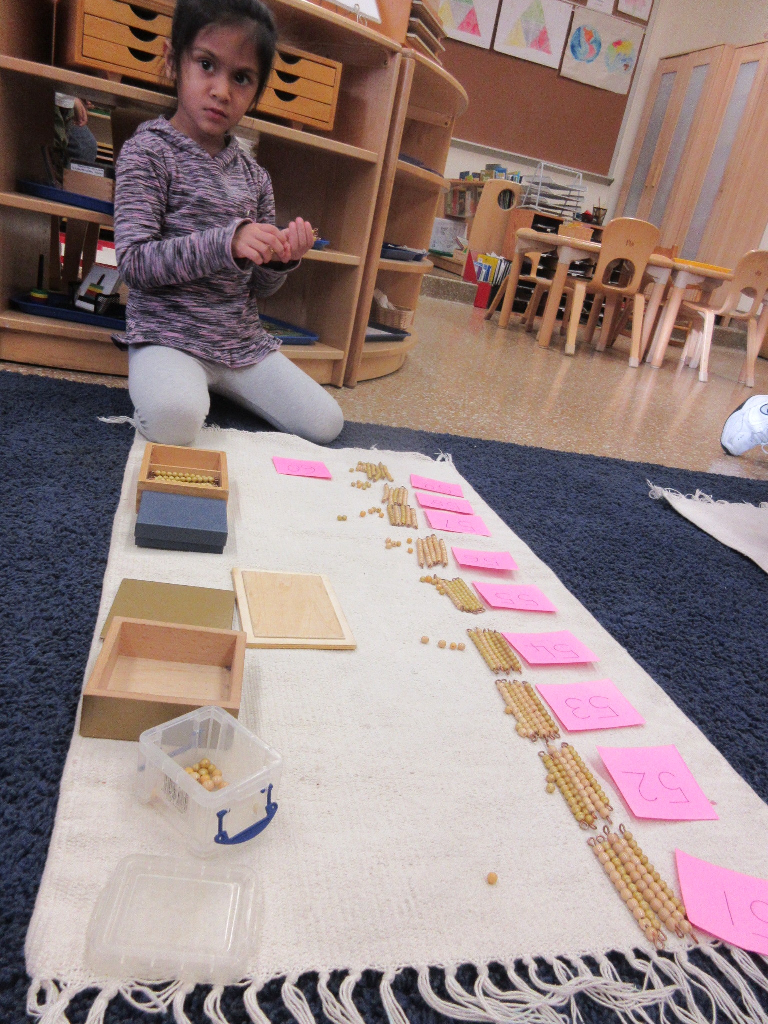 Working on Tens with golden beads!