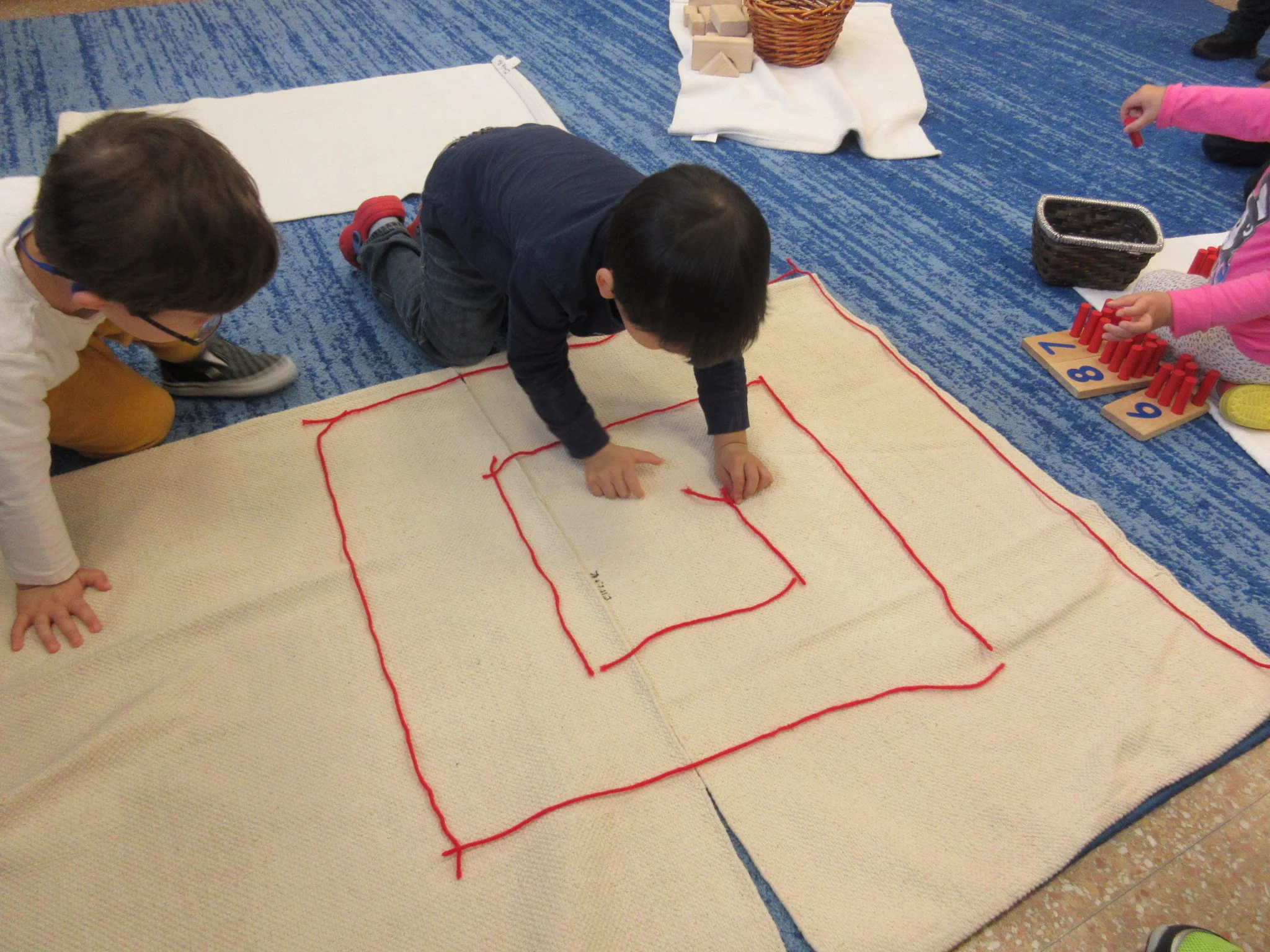 Red Rod extension work: laying out the red yarn to create a maze