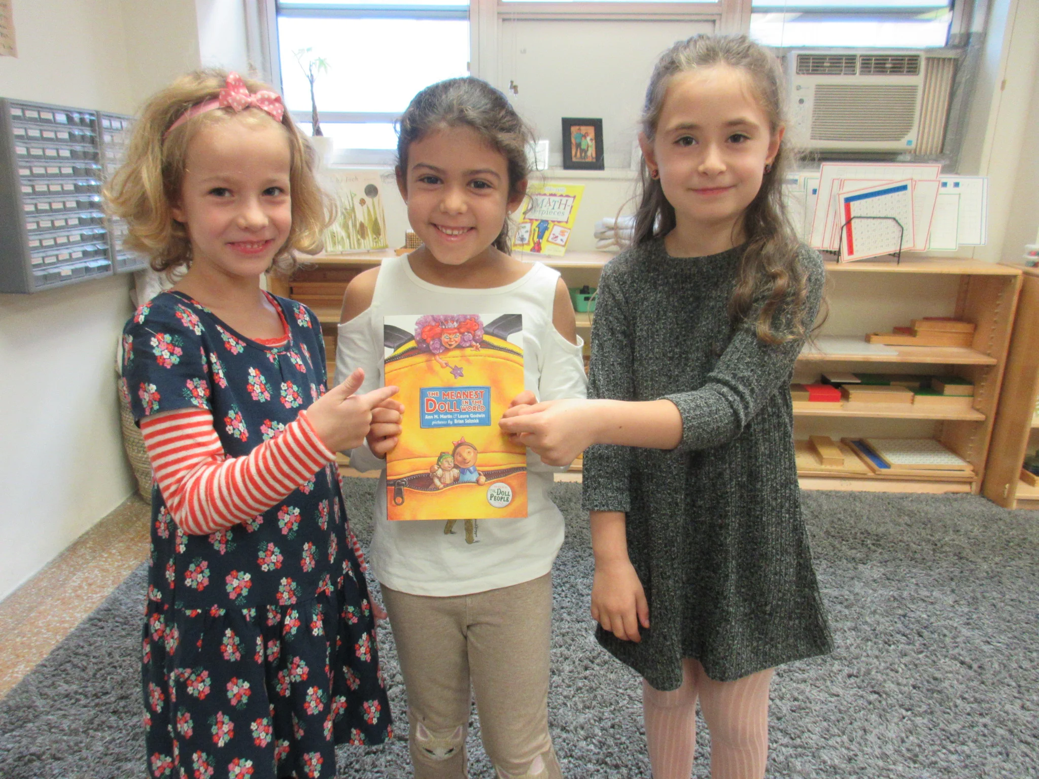 On to the next! We're blazing through books and we are starting.... "The Meanest Doll in the World" by Anne Martin and Laura Godwin