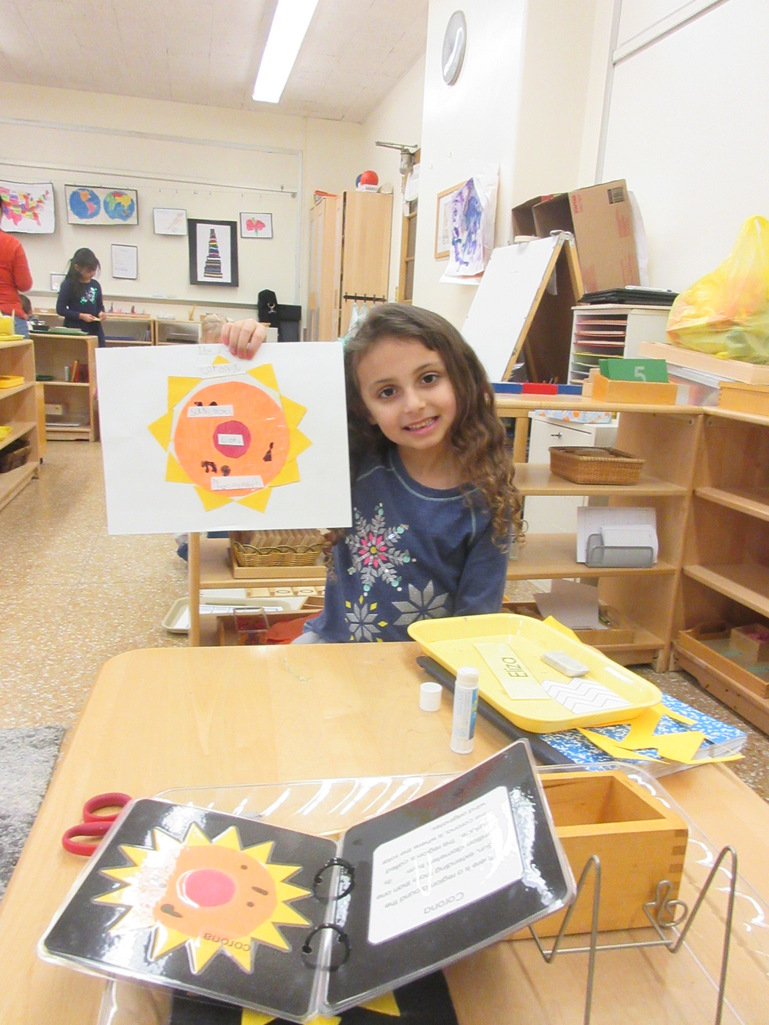 Learning about parts of the sun and made one for herself.
