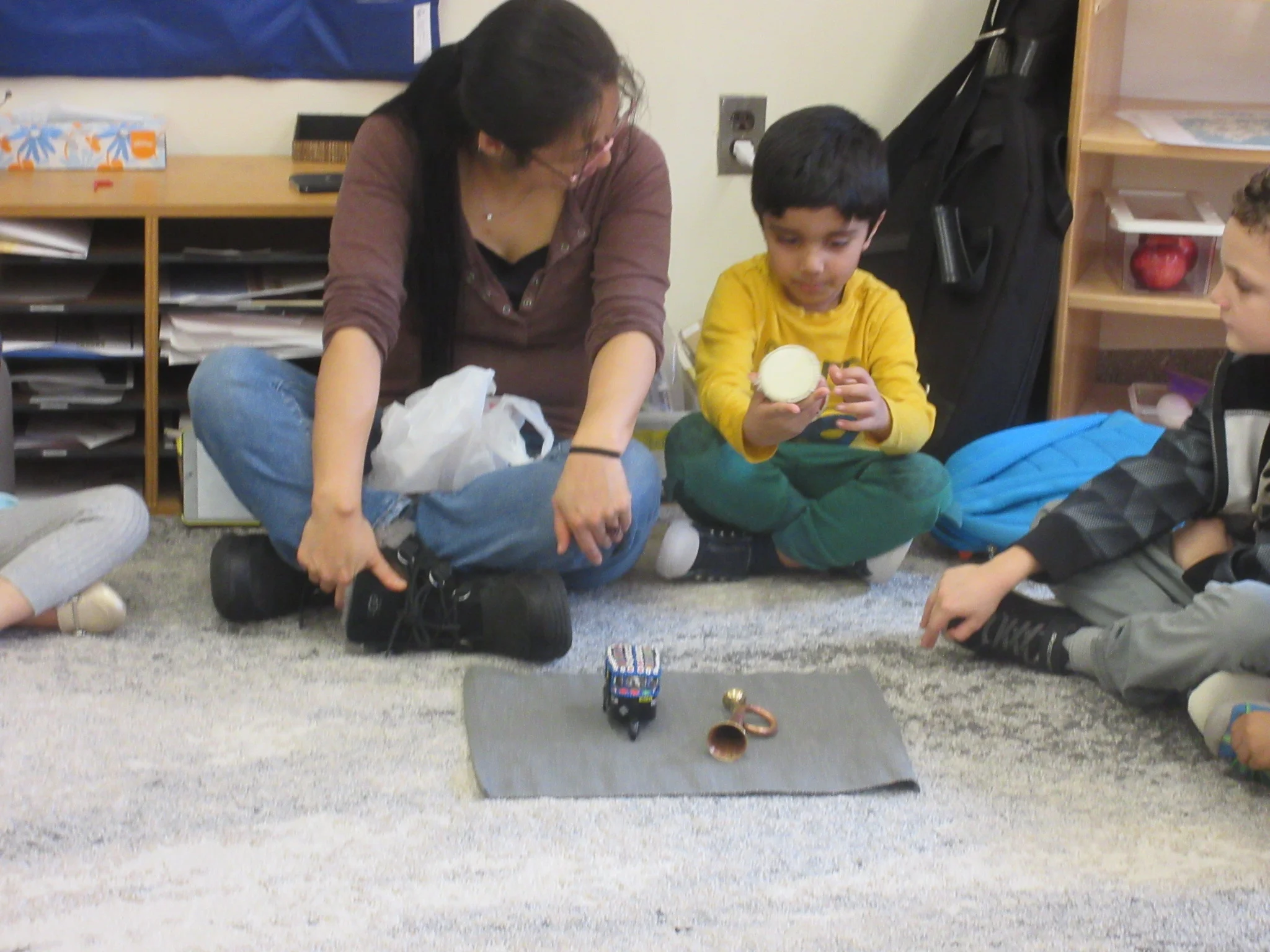 Sharing his special things at circle that he collected from his India trip