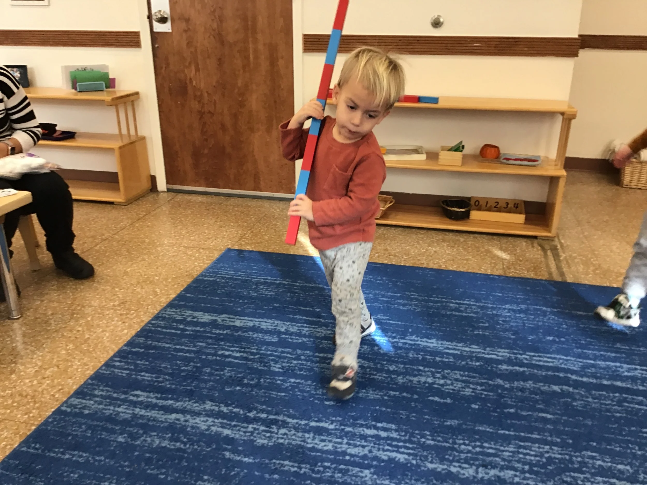 Carefully carrying the Number rods. 