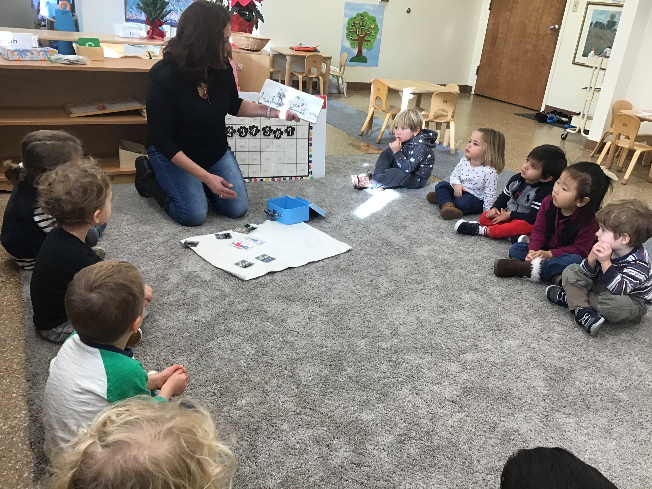 Reading the book “We’re Going on a Bear Hunt”.