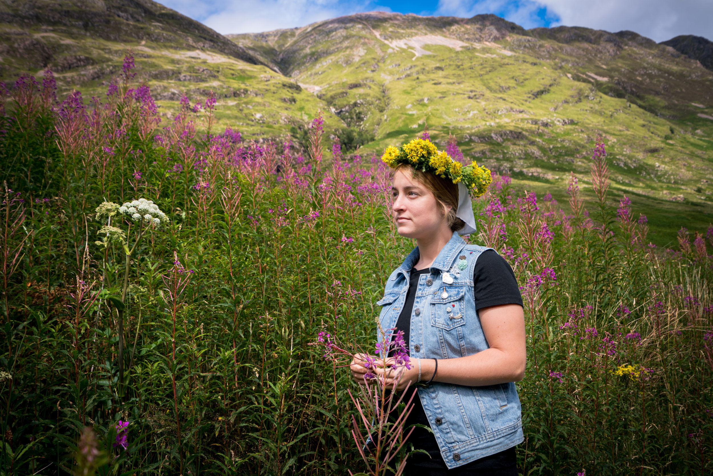 My sister Heidi posing amidst the flowers and Scottish mountains with the flower crown she made