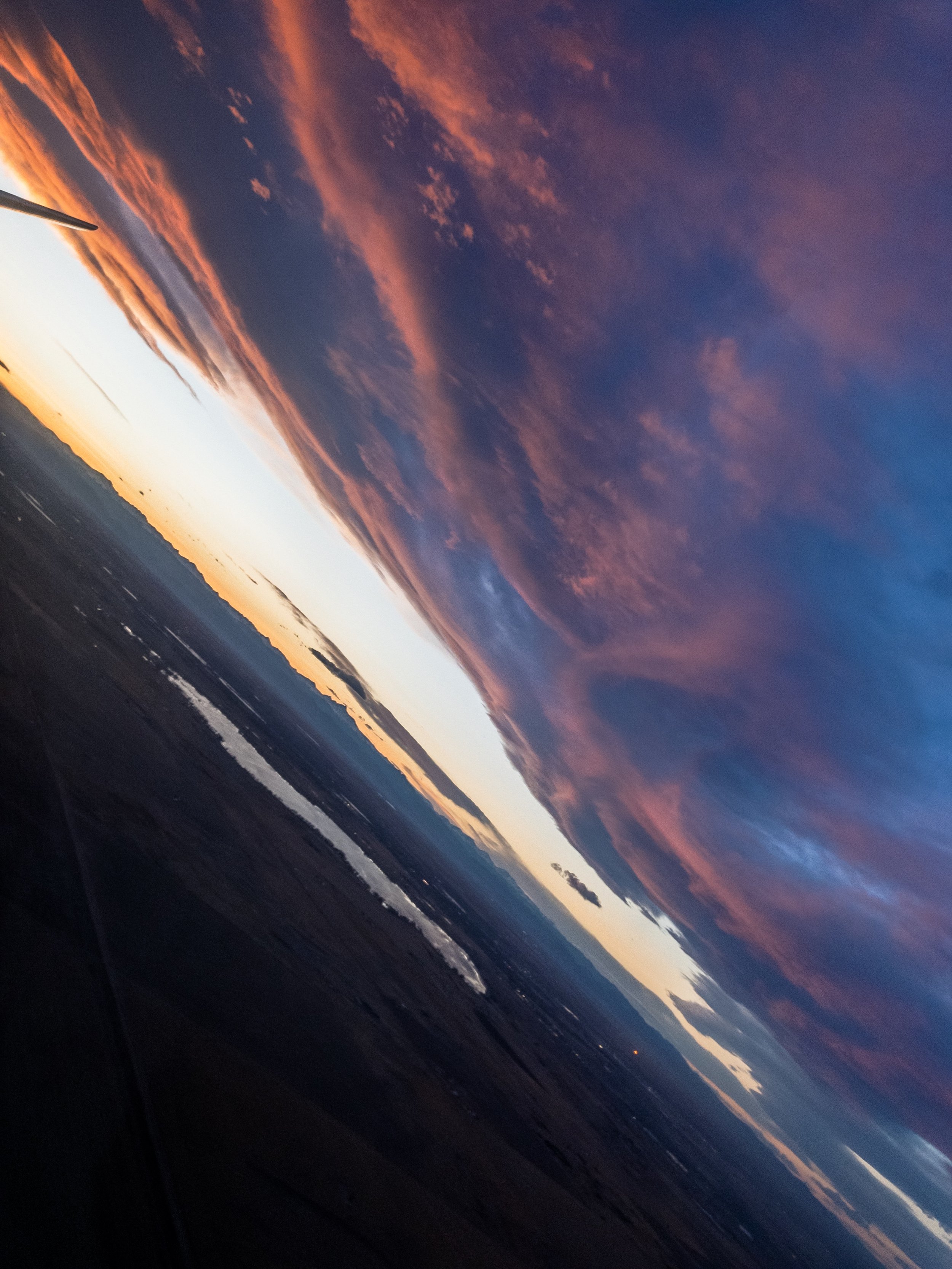 Sunset from the air over the Denver Rockies, taken with iPhone 7+ with Lightroom's HDR function