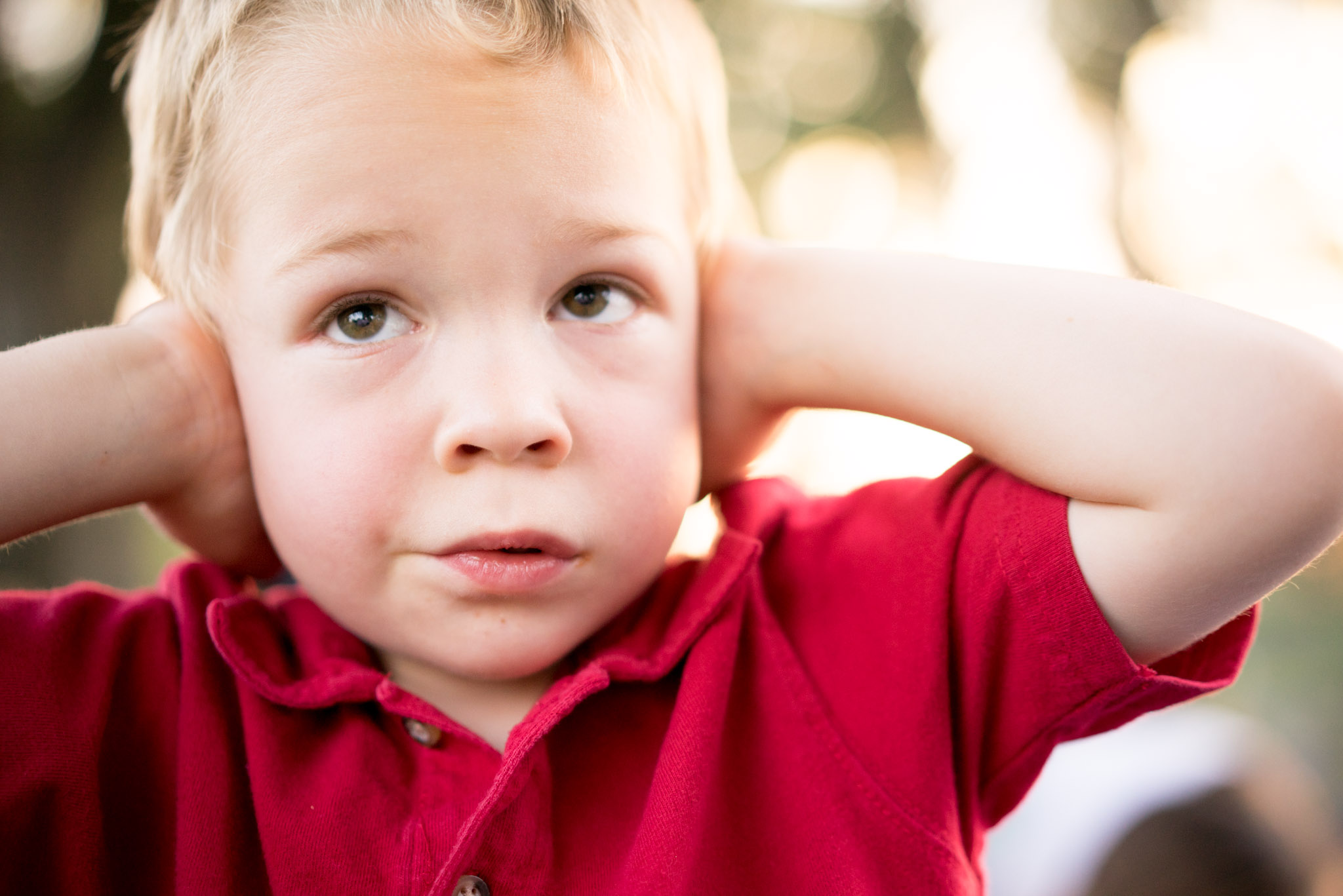 My cousin's son who does NOT appreciate the loud noises of fireworks and kept his ears covered the entire evening, poor guy. Sony A7r, 55mm, f/2, 1/250th, ISO 400. (For this kind of shot, I set my settings to M for Manual, set it at f/2 and 1/250th and then I set my ISO to Auto. This automatically chooses the exposure while giving me a narrow depth of field for portraits and keeping the shutter speed fast enough so that it doesn't blur. That's one of my favorite setups for casual portraits and it works especially well because Sony cameras handle high ISOs so much better than most cameras.