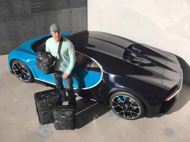 Paris Renfro (6-inches tall in this photo) is posing next to his die-cast Bugatti Chiron. To see more of Paris Renfro designs, see his website at www.prdminiatures.com