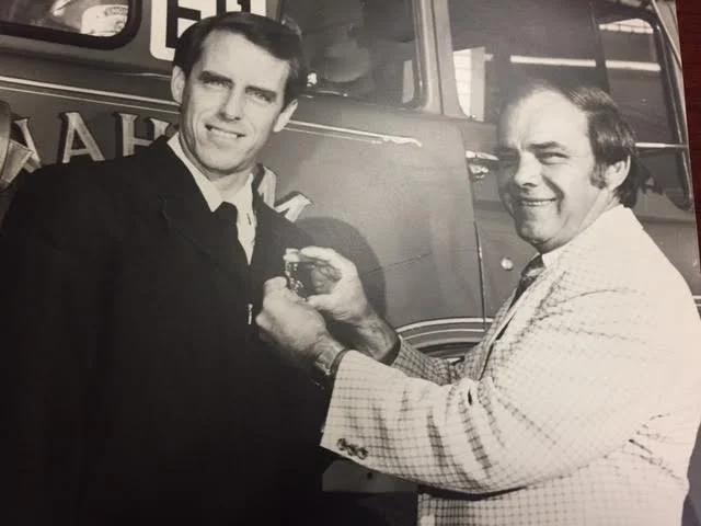 Fire Chief Bob Simpson presenting Jeff Bowman with his B/C badge 1983