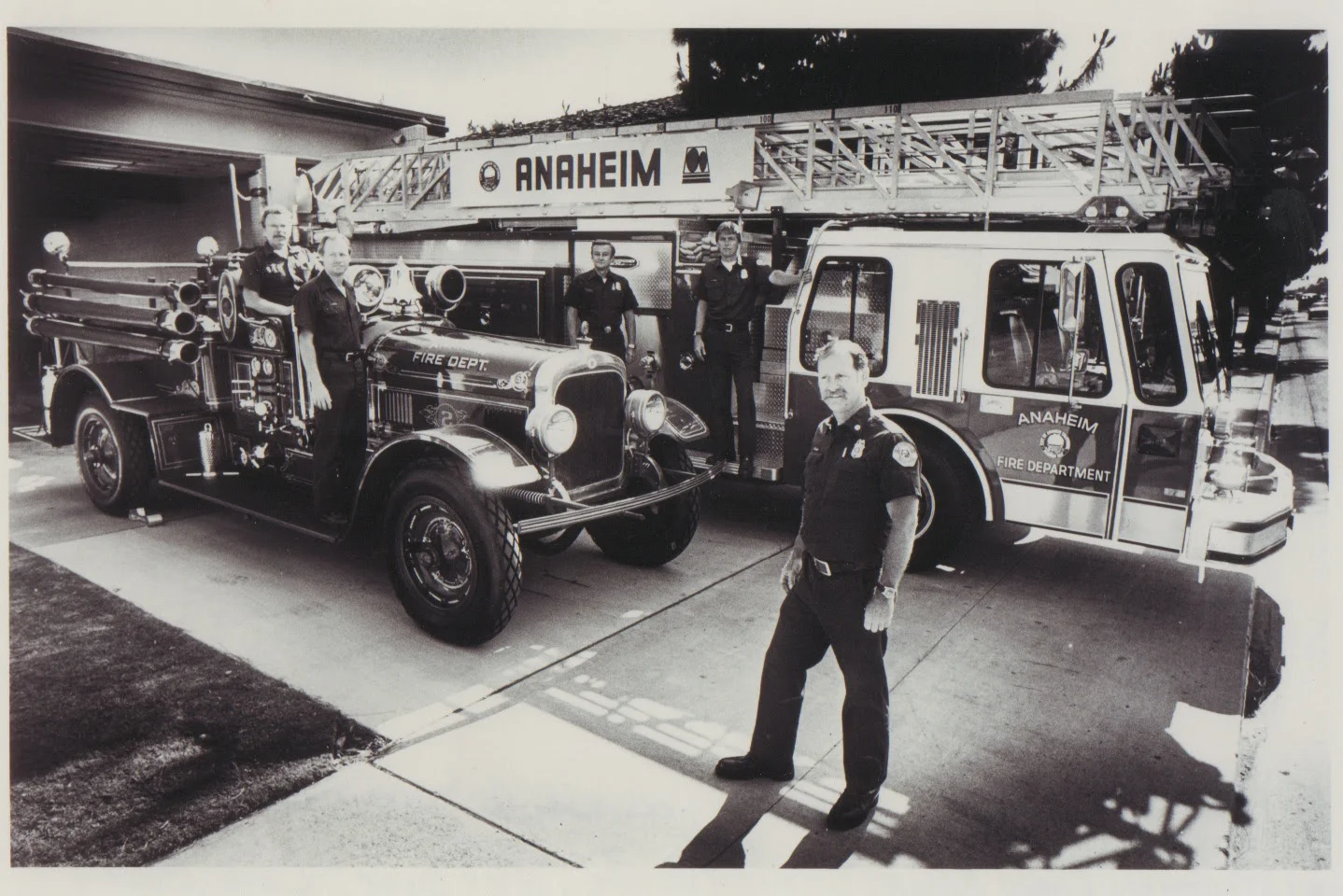 OLD 1925 SEAGRAVE ENG. 2 , AND NEW 1985 EMERGENCY ONE QUINT 110 FT.  AERIAL LADDER TRUCK AND PUMPER COMBINATION 