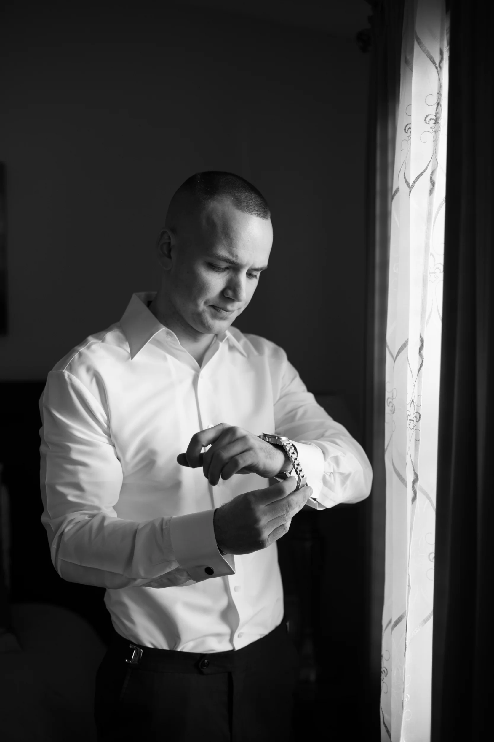 Groom puting watch on.jpg