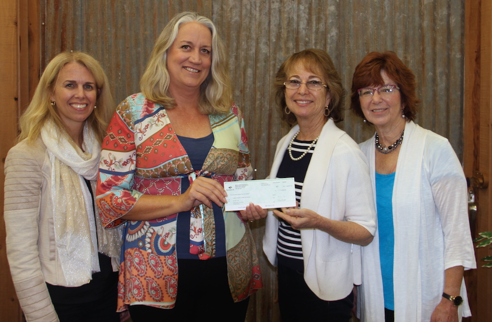 Homestake Mining Company (Barrick Gold Corporation) donated $5,000 to #LakeCountyRising. In this photo: Debra Sommerfield, Lake County Winegrape Commission; Peggie King, Homestake Mining Company; Sharron Zoller, Lake County Wine Alliance; and Terry Dereniuk, Lake County Winery Association.