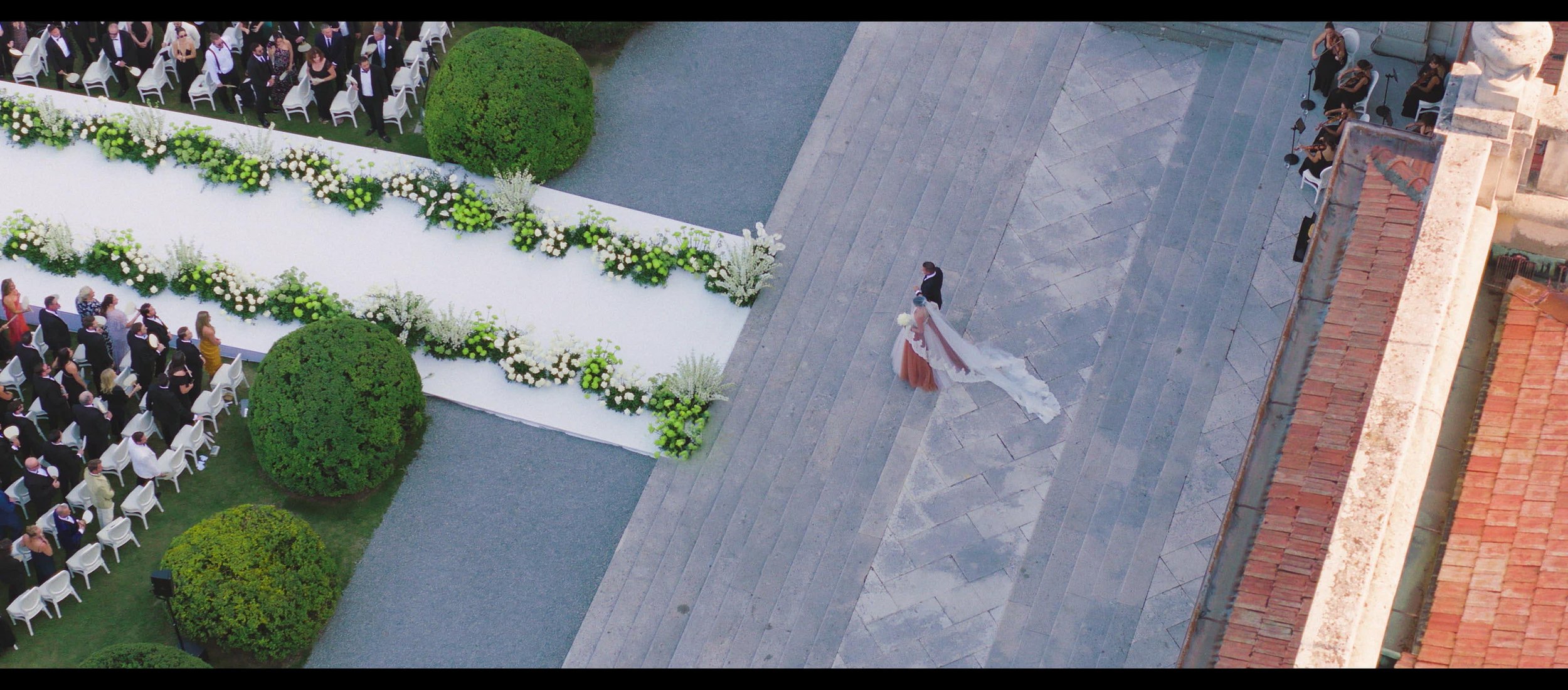 Luxury wedding ceremony entrance drone shot 