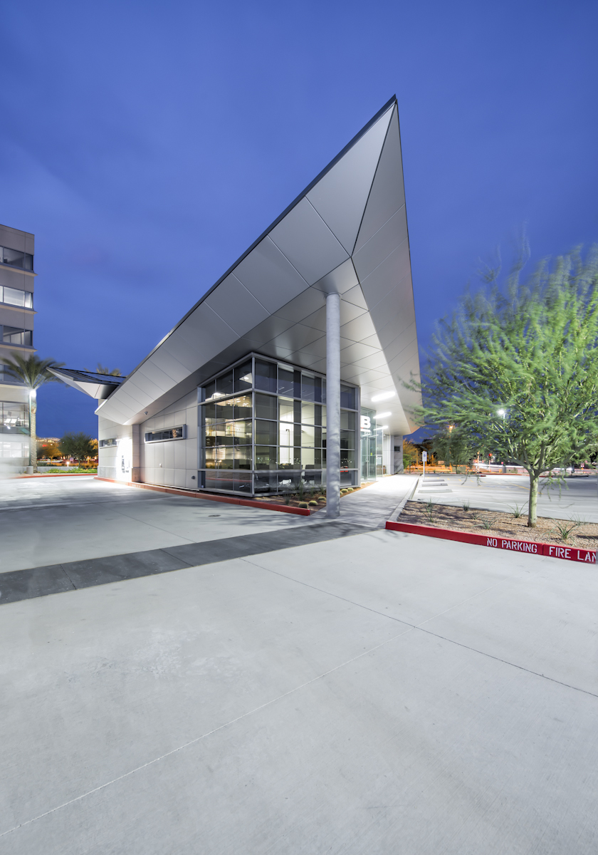 The palette of exterior materials, sugar cube limestone, cast-in-place concrete, slate, glass and metal panels give the building scale and a presence of its own on the site.