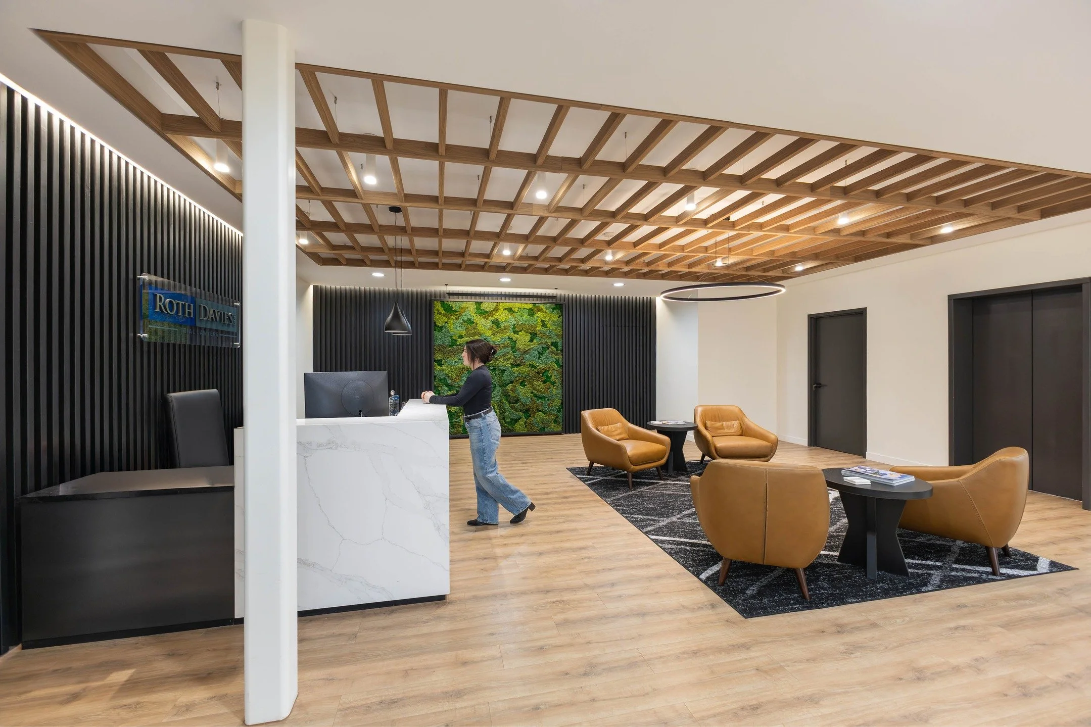 Step inside Roth Davies Law&rsquo;s refreshed office, where a vibrant moss wall, custom wood-look ceiling feature, and curated lighting create a welcoming, modern reception. Every detail was carefully considered to craft a professional space that&rsq