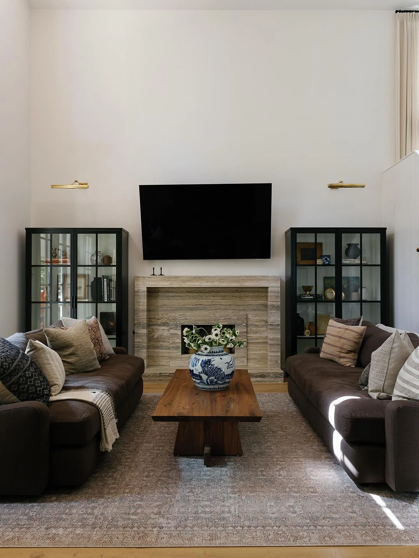 A custom fireplace, lighting, furnishings and millwork at one of our Calabasas remodels. An amazing living room to hang and host in. 

Interior Design &amp; Styling by us @designhutch.la 
Photography by @victoriagoldphotography